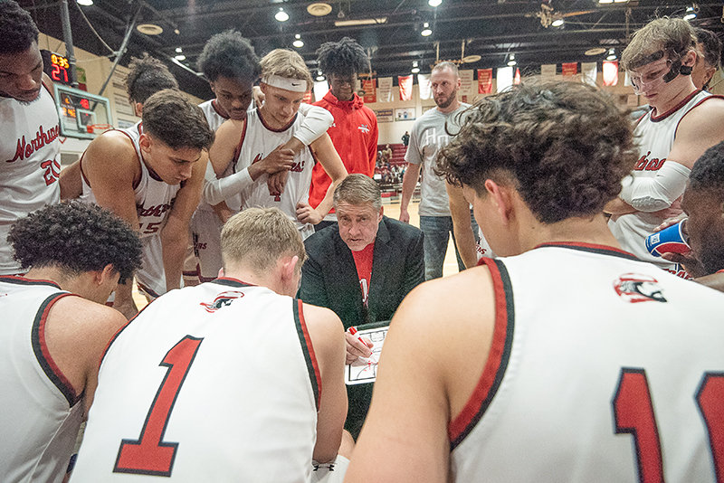 NWC coach Andy Ward works through a play with the Trappers during a timeout in a matchup against Miles Community College on Dec. 16.