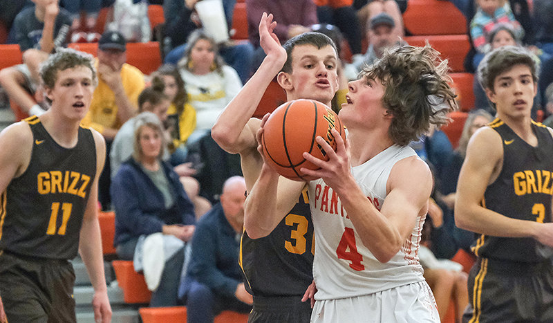 Brock Johnson drives into the paint during the second quarter on Saturday against Rocky Mountain during Powell&rsquo;s home opener.