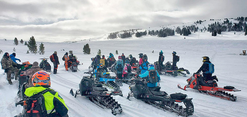 Snowmobilers gather for an avalanche training in the Beartooth Mountains on Saturday.