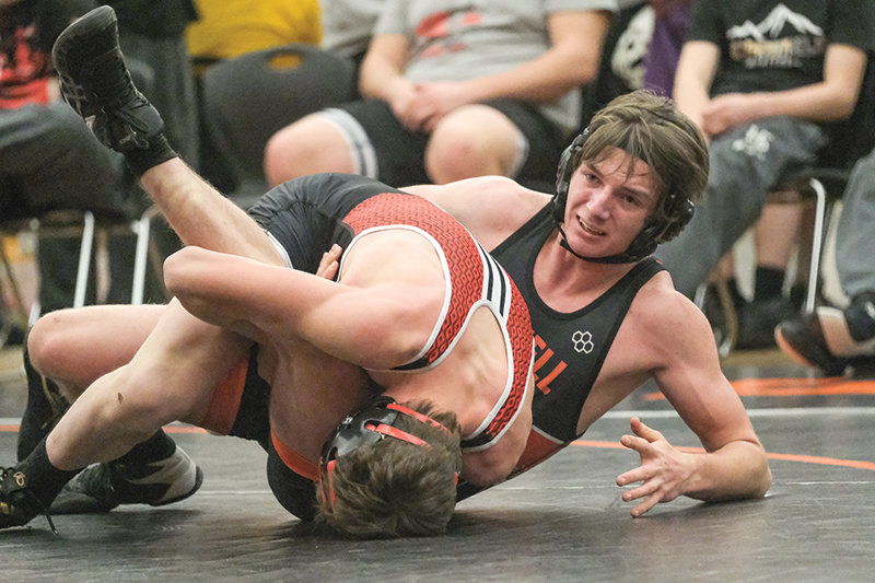 Wyatt Heffington (right) tries to flip his opponent during the Panthers&rsquo; dual against Huntley Project on Tuesday.