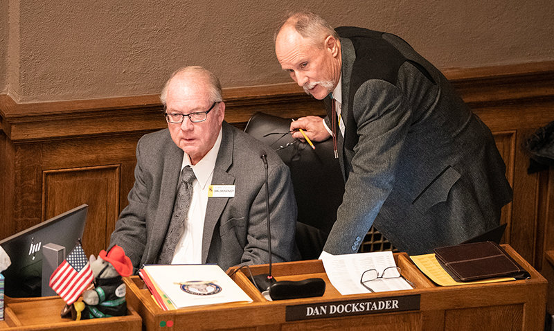 Sen. Dan Dockstader, R-Afton, talks with Larry Hicks, R-Baggs, before the start of the morning session Jan. 13 in the Senate Chambers.