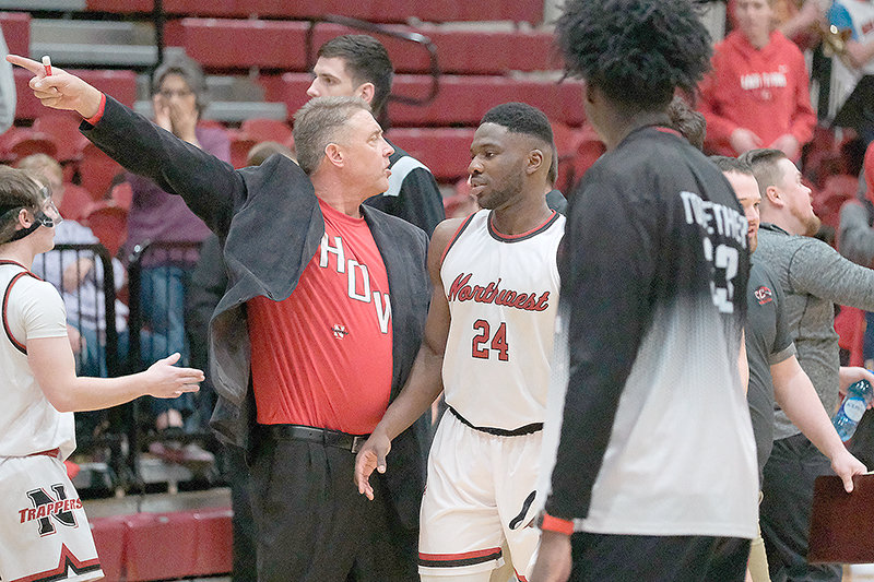 Northwest College men&rsquo;s coach Andy Ward directs his players towards the locker room after a scuffle broke out immediately following the Northwest vs Casper College game on Saturday.