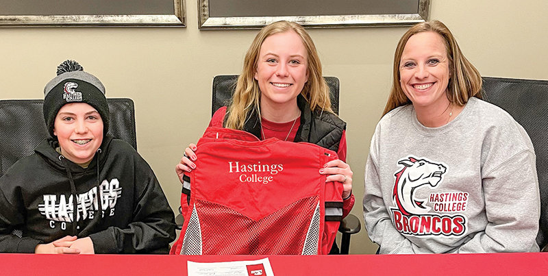 From left, Austin Sears, Hannah Sears and Katie Sears pose for a photo at Hastings College in Hastings, Nebraska. Hannah signed with the Hastings shooting team on Feb. 18.