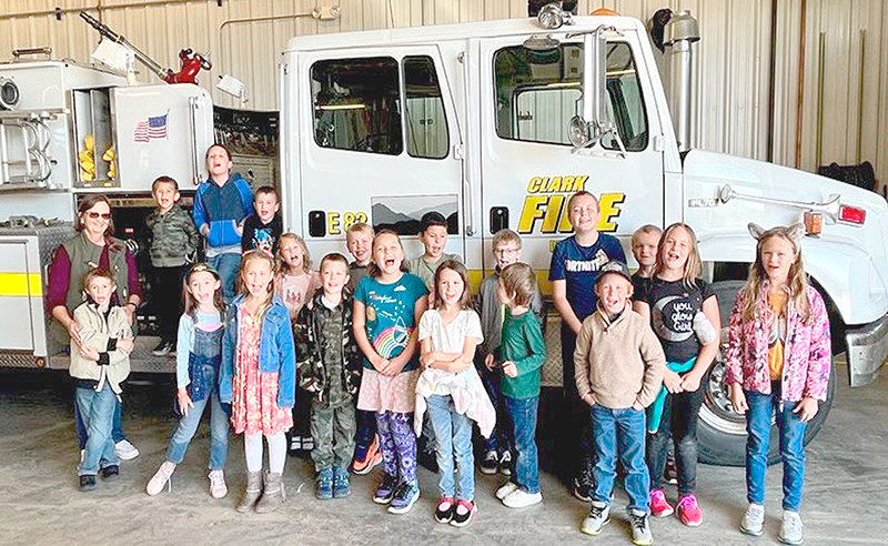 Clark Elementary School students pose in front of a Clark fire truck while on a field trip. Clark&rsquo;s student population doubled this year. Last year&rsquo;s total enrollment for kindergarten through fifth grade was just 10 students.