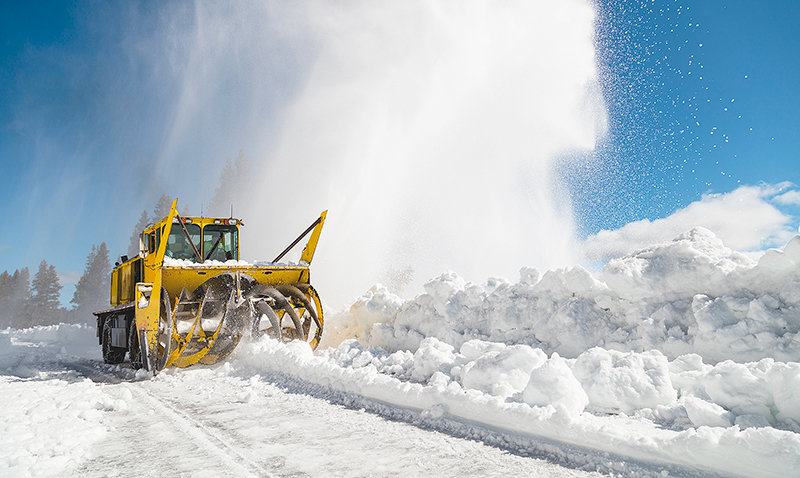 Yellowstone National Park crews plow the Northeast Entrance Road, giving residents of Cooke City and Silver Gate their only option for emergency and convenience services during the winter.
