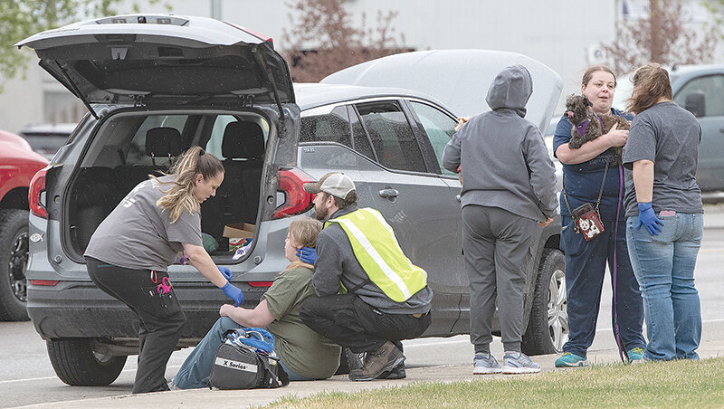 EMTs from Powell Valley Healthcare tend to one of several people involved in a Thursday afternoon incident, in which a speeding driver reportedly struck four different vehicles on Coulter Avenue. There were no serious injuries reported &mdash; something police called &lsquo;miraculous&rsquo; &mdash; but one woman later reported to the emergency room with pain.