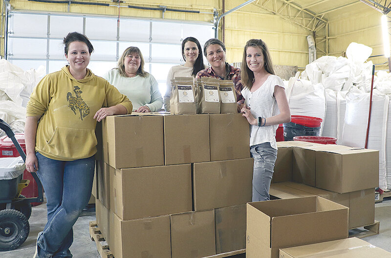 From left, Sara Wood, Mindy Meuli, Megan McGuffey Skinner, Caitlin Youngquist and Kali McCrackin Goodenough finish packing boxes of spelt flour for pickup by Food Bank of Wyoming.