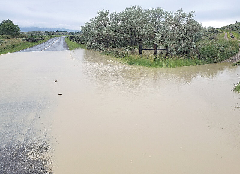 Flash flooding led to water temporarily flooding part of the roadway on County Road 2AB outside of Cody. It was one of a number of areas that saw flooding Monday afternoon during a period of heavy rains, along with roads in Clark, Wapiti and near the Willwood Dam in rural Powell.