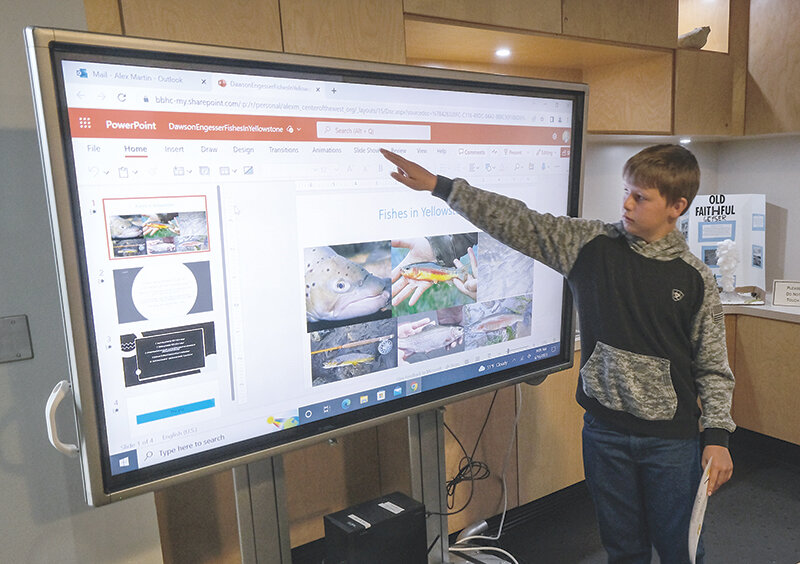 Westsider Dawson Engesser shows off his slideshow project on fish in Yellowstone.
