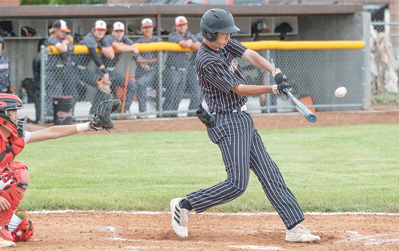 Jacob Gibson swings through a ball against Lovell on Friday. Gibson pitched a complete game to help Powell sweep the Mustangs in Cowley.