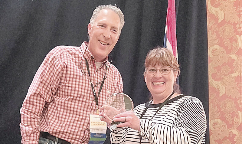 Cody attorney Colin Simpson, a past president of the organization, presents Janci Baxter of Powell with the&nbsp;Wyoming Trial Lawyers Association 2023&nbsp;Member of the Year award.