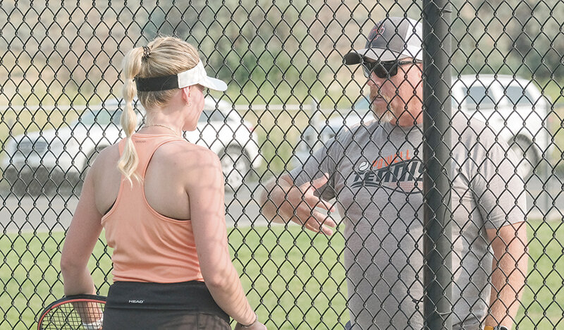 Powell High School coach Joe Asay (right) looks to help develop future Panther tennis players during a tennis camp next week at PHS.
