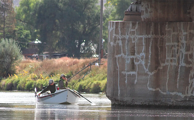 A guided angler floats under a Thermopolis bridge over the Bighorn River in September 2022. Roughly 40% of all anglers Wyoming Game and Fish surveyed on the Bighorn are guided, according to a 2021 report.
