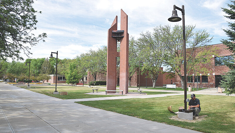 Carson Murdock of Bar T Electric works on new light pole installations across Northwest College&rsquo;s campus, as the school moves into a new budget cycle after approving its fiscal year 2024 budget July 10.