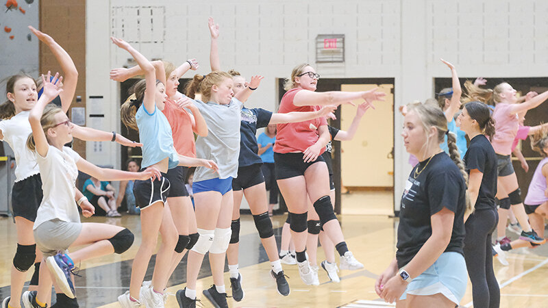 Middle school athletes work on their timing and form for spiking a ball during the Trapper volleyball camp last week.