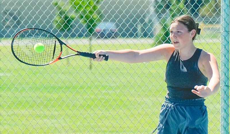 Maya Landwehr returns a point during a rally at practice on Friday. Landwehr is one of three returning Panthers from last year&rsquo;s girl&rsquo;s team that went to state.