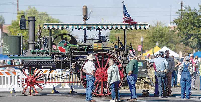 People check out old machinery during last year&rsquo;s Homesteader Days festival in downtown Powell. This year&rsquo;s event features more of the same attractions, with old machinery, classic cars, vendors and more.