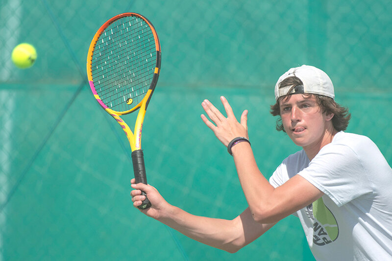 Taeson Schultz returns with a forehand during the Panthers&rsquo; matchups against Casper on Saturday. Powell heads to Gillette for the North Regional Tournament this Friday and Saturday.