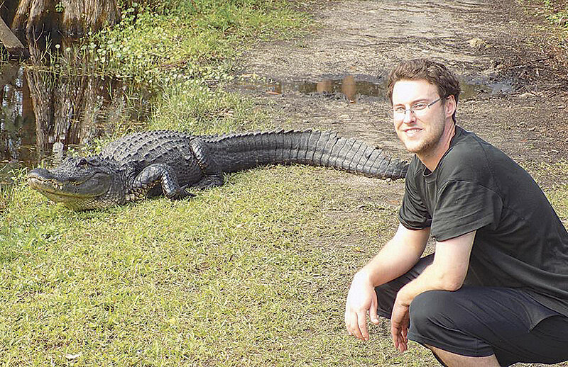 Mark Aughton, the Wyoming Game and Fish Department&rsquo;s newly hired Cody Region Bear Wise program coordinator, is seen with an alligator while working as a wildlife biologist in Florida prior to coming to Wyoming.