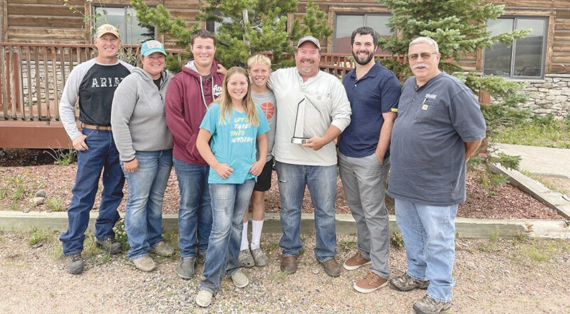Ryan Muecke, senior area representative with WBI Energy (third from right) received the Liberty Mutual Life Saver Award for his actions to help a teenage boy in an ATV accident. Pictured with Muecke, from left, are Brian Voss, WBI Energy Worland District transmission supervisor; Muecke&rsquo;s wife, Christy, and children, Curtis, Charlee and Tucker; Brandon Hoehn, technical consultant with Liberty Mutual; and Mike St. Clair, WBI Energy Worland District manager.