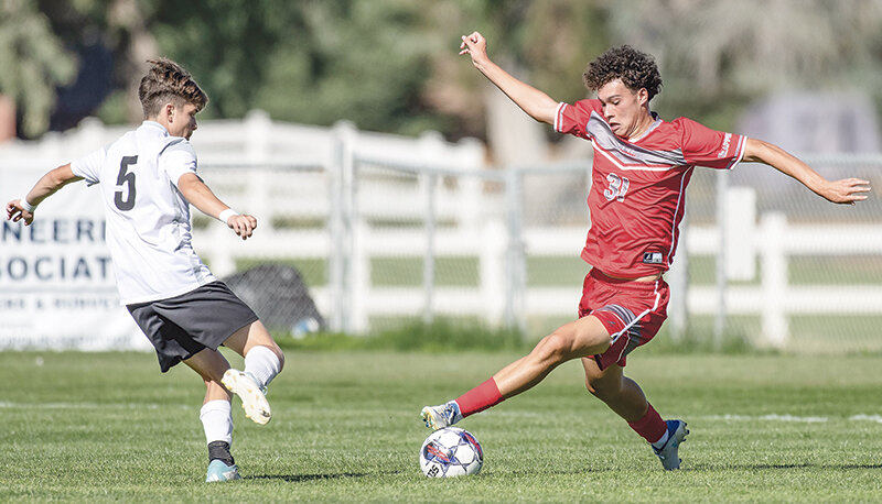 Artur Dalifor Kataoka taps the ball past a defender against Lamar on Sept. 16. Northwest split its road contests against Trinidad State and Otero this past weekend.