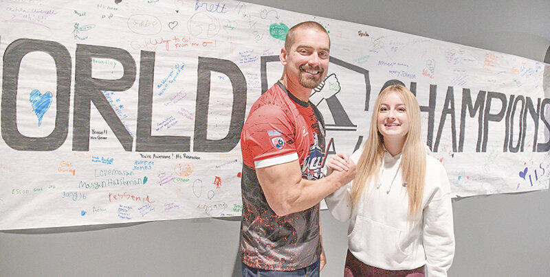 Father Devin and daughter Charlotte Bair, of Lovell, both won gold medals as part of Team USA at an international arm-wrestling competition last month in Malaysia. The pair returned home to a celebration last week in Lovell.
