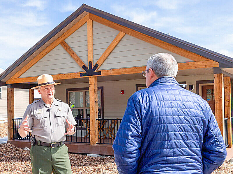 Yellowstone National Park Superintendent Cam Sholly discusses one of several new modular housing units that are replacing substandard employee housing in the park.