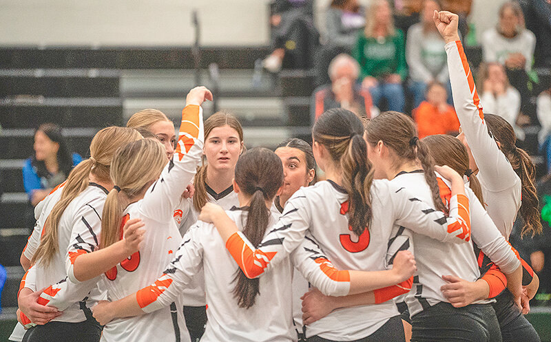 The Powell Panther volleyball team huddles before a match against Lander on Friday. Powell survived an early scare by the host Tigers and went on to win its first 3A West regional title in nine years.