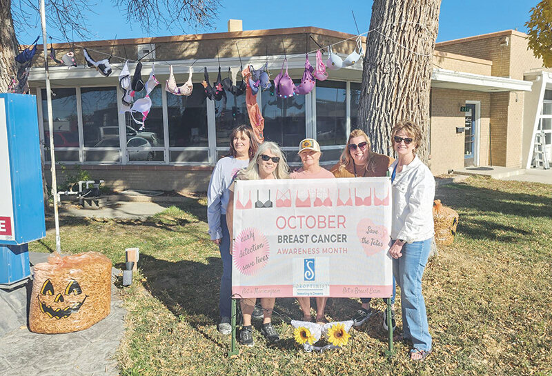 Soroptimist of Powell members Paulette Bagnell (from left), Rosanna Janzer, Sherri Simpson, Amy Wells and Dawn Jarrett show off the decorations they made in front of Hunter Clean Care to raise awareness of breast cancer.