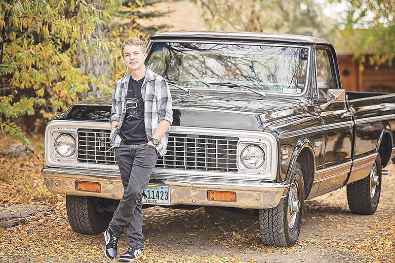 Averee Johnson poses next to his family&rsquo;s Chevy C10 for his graduation picture. The truck has been in the family for nearly 50 years beginning with his great-grandparents Joan and Nelson Cross. After his great grandmother&rsquo;s passing, Avery found a copy of the picture with a story and the name of the truck written on the back.