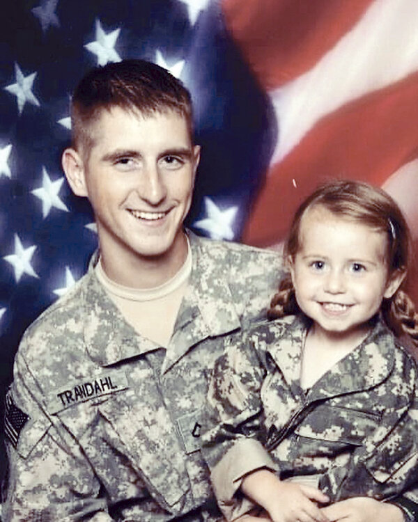 Lily Trandahl, senior at Upton High School, is entering the Wyoming Army National Guard, pursuing a lifelong dream to follow in her father&rsquo;s footsteps as a soldier. A young Trandahl is pictured with her father, Nick Trandahl, when he was on leave during his deployment in 2009.