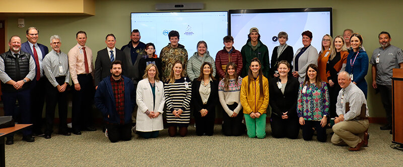 Cody Regional Health staff stand with students and staff from Cody High School, Heart Mountain Academy and Park County School District 6 administrators to kick off a RIDE pilot program on health care career pathways.