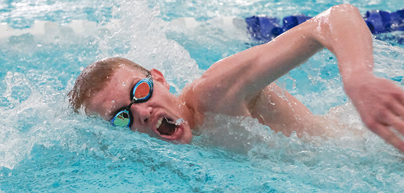 Liam Taylor pushes down the final stretch of the 100 free during the Gene Dozah Invitational on Saturday. Powell batted to a fourth place finish after winning a triangular on Friday.