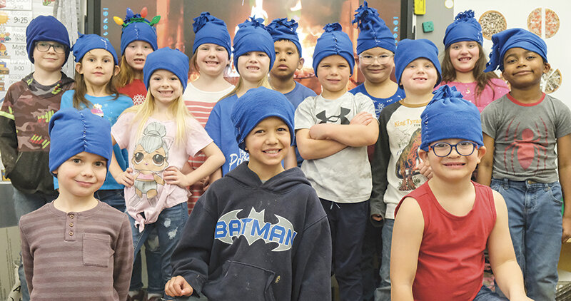 Powell elementary school students, including students at Powell Christian School, showed some Christmas spirit this holiday season when they wrote personalized letters to local American Legion members for Christmas. Pictured is Parkside Elementary School teacher Jill Ferguson&rsquo;s first grade class wearing hats they made to stay warm this winter season. Back row, from left: Ash Mumm, Madilyn Baker, Holly Peterson, Brenlee Moger, Noah Garcia, Aksel Brown and Marilynn Jarvies. Middle row: Lennyx Sanders, Averie Padilla, Paxton Gonzalez, Kyzer DeHaan and Henri Elijah. Front row: Bjorn Brown, Kylar Miears and Joseph Martinez.