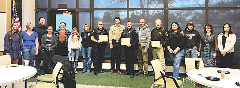 Members of the Northwest College Criminal Justice Club pose for a photo with representatives from the Powell Police Department, Cody Police Department, Park County Sheriff's Office and Big Horn County Sheriff's Office during a Tuesday event recognizing Law Enforcement Appreciation Day.