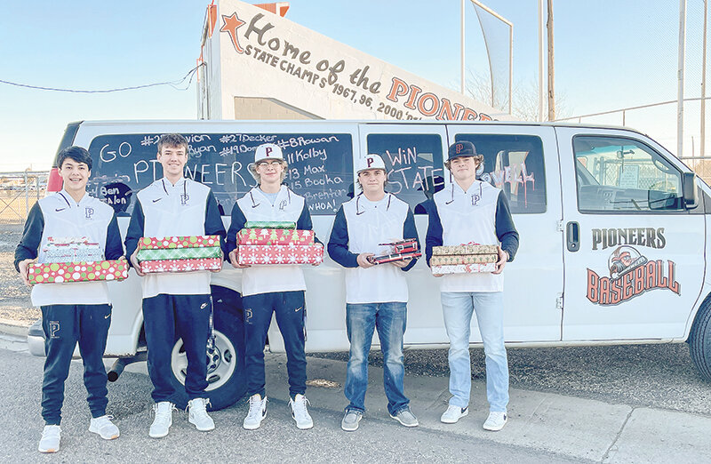 From left, Ethan Welch, Jacob Gibson, Dalton Worstell, Aiden Greenwald and Brock Johnson pose for a photo with gifts they later delivered to a needy family for Christmas. The five seniors are hoping to repeat as state champions this coming spring.