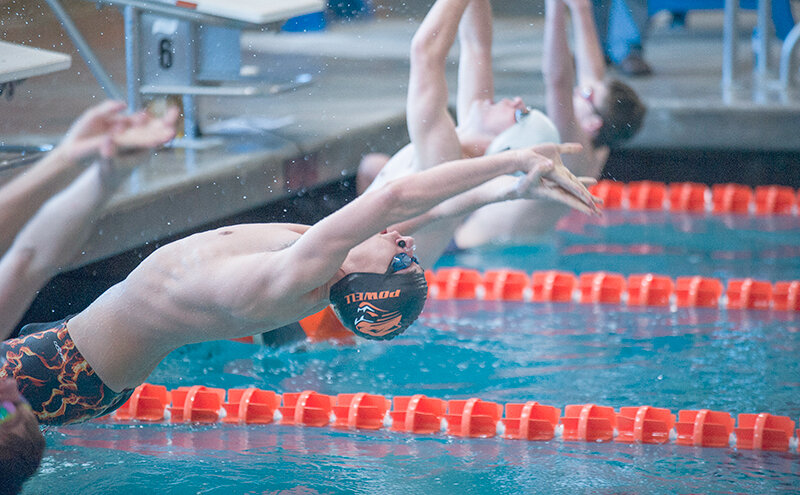 Will Fuller launches off the blocks during the 100 back at the Worland Invitational on Saturday. He earned a third place finish as Powell finished third as a team at the meet.