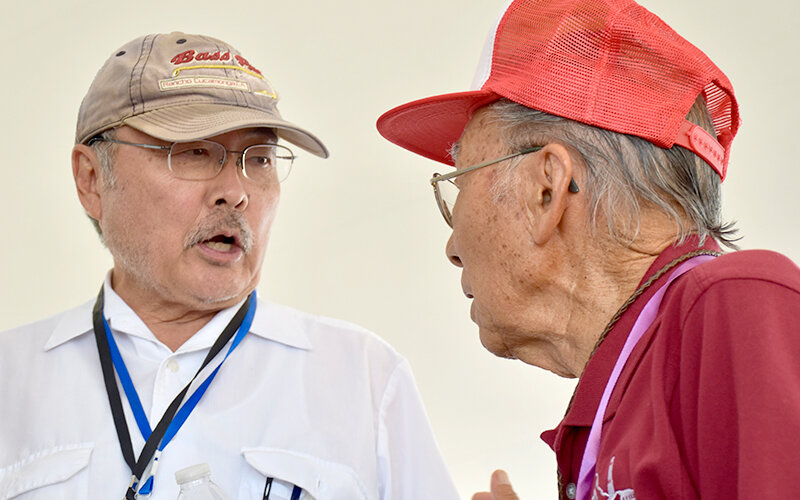 Former Los Angeles County Superior Court Judge Lance Ito (left), whose parents met at Heart Mountain, and former incarceree Bacon Sakatani talk at the 2023 Heart Mountain Pilgrimage.