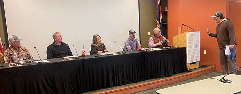 North Fork resident Brian Clarkson (far right) argues with the members of the Park County Planning and Zoning Commission following the certification of a revised land use plan. The commission includes, from left, Rand Mair, Guy Eastman, Kimberley Brandon-Wintermote, Brian Peters and Duncan Bonine.