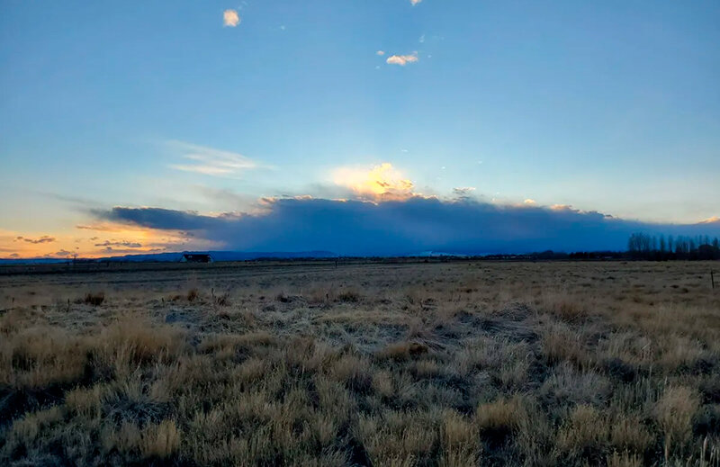 A winter sunset over a snowless prairie at Laramie River Greenbelt Park in Albany County.