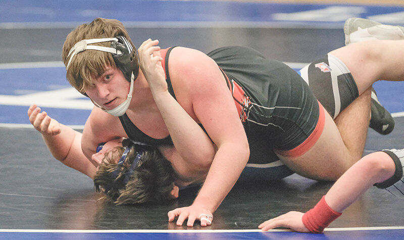 Denton Wainscott pins his Lovell opponent in a dual last Thursday. Powell will wrap up the regular season this Thursday, hosting a dual against Cody at Powell High School.