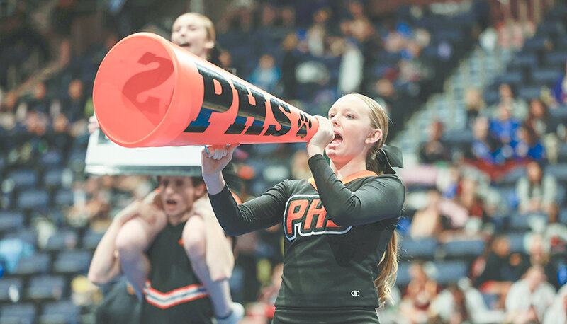 Brooklynn McConnell helps hype up the crowd with her megaphone during the Panthers game day routine at state spirit in Casper.