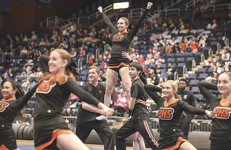 Kolby Crichton (bottom right of pyramid) was named to the All-State co-ed cheer team to cap off his high school career. He and teammate Conner Howard hold up Kora Terry during the state co-ed routine in Casper on Jan. 26.