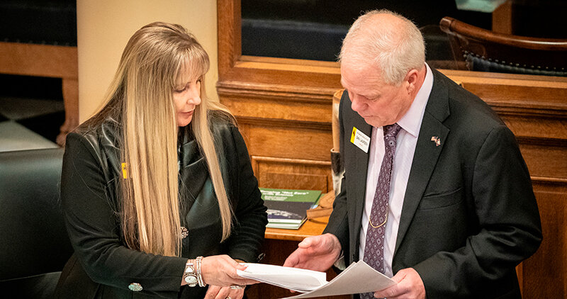Sen. Cheri Steinmetz (R-Lingle) speaks with Sen. Dan Laursen (R-Powell) before the morning session Feb. 13 in the Senate Chambers at the Wyoming State Capitol Building. Both voted for the Senate budget bill.