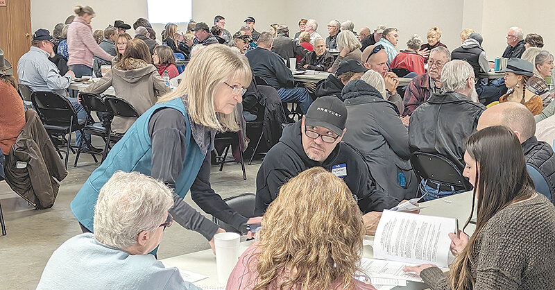 Park County Republican Party State Committeewoman Karen Jones visits with fellow GOP members during the party’s Feb. 3 caucuses at Homesteader Hall at the Park County Fairgrounds. Party members will gather again at the fairgrounds on Saturday, for their biennial convention.