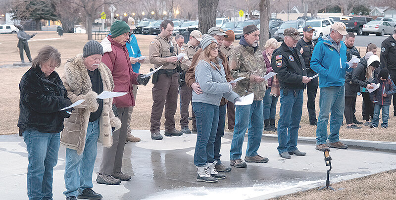 Community members gathered for a vigil in honor of Sheridan Police Sgt. Nevada Krinkee on Friday at Cody City Park. Cody Mayor Matt Hall, Cody Police Lt. Beau Egger and Cody Police Chaplain Warren Murphy spoke at the event.