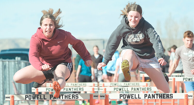 Kate Williams (left) and Leah Graham hurdle together during practice last week. Both will look to move up the ranks for the Panthers this year as the program seeks a fourth straight track title.