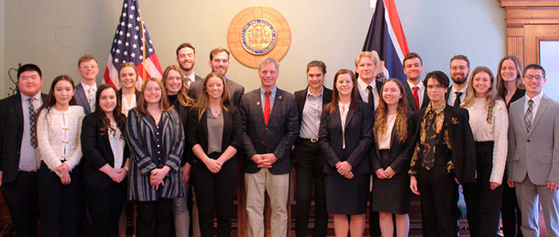 Gov. Mark Gordon meets with WWAMI students in his ceremonial chambers at the State Capitol. Front row, from left: Anh Huynh, Tatiana Smith, Annaliese Fitzsimmons, Sabrina Gay, Gordon, Brandi Carreau, Chantelle Barr, Dean He, Anna Ujvary and Hyrum Ruby. Back row, from left: Sai Kit Ng, Matthew Rasmussen, Riley Pilon, Victoria Toscana, Kaden Moore, Quinton Brooks, Emma Miller, Aaron Nichols, Bradford Burns, Rafael Homer and Clara Bouley.