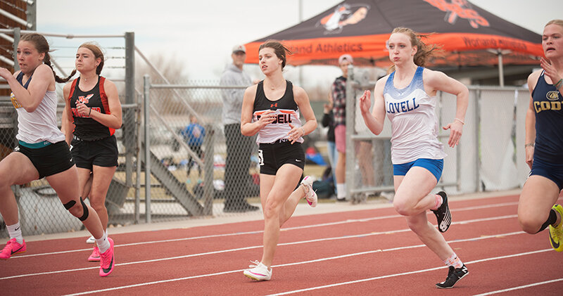Averie Warner (center) and the Panther girls finished runners up in their first meet of the year, just 13 points behind host Worland last Thursday.