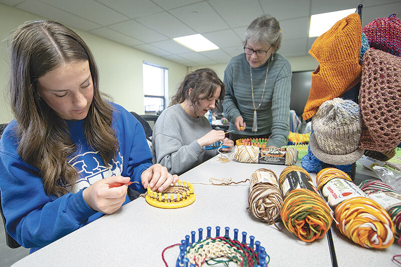 Olivia and McKencie Oilar get individual instruction from Powell&rsquo;s Jan Sapp during a knitting class in Northwest College&rsquo;s Center for Training and Development as part of the Homestead Series, organized by NWC&rsquo;s Christi Greaham and Powell Christian School&rsquo;s Christy Muecke.